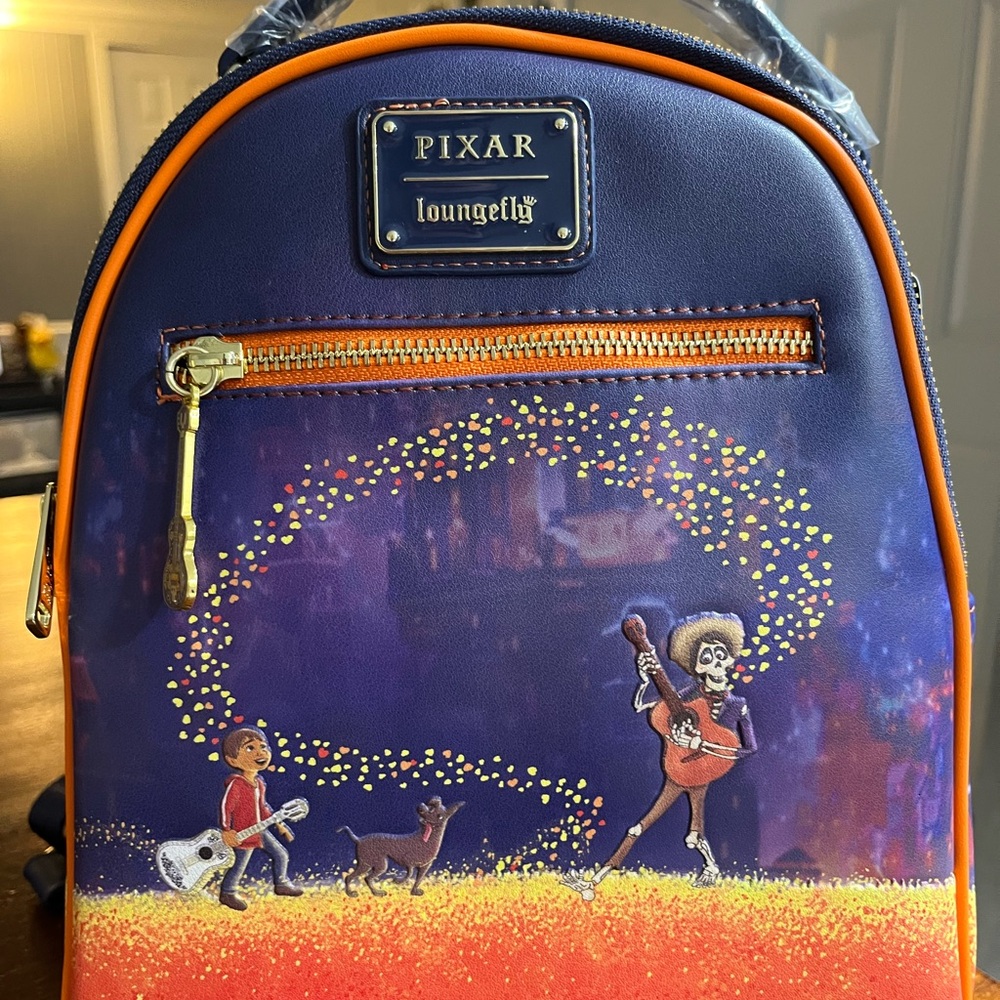 Loungefly coco Pixar Backpack in Blue and Orange